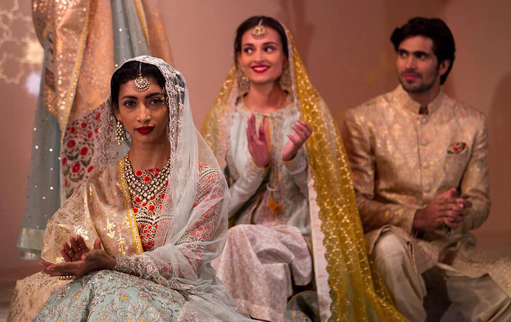 Models display creations by designer Anju Modi at the Amazon India Couture Week 2015 in New Delhi.