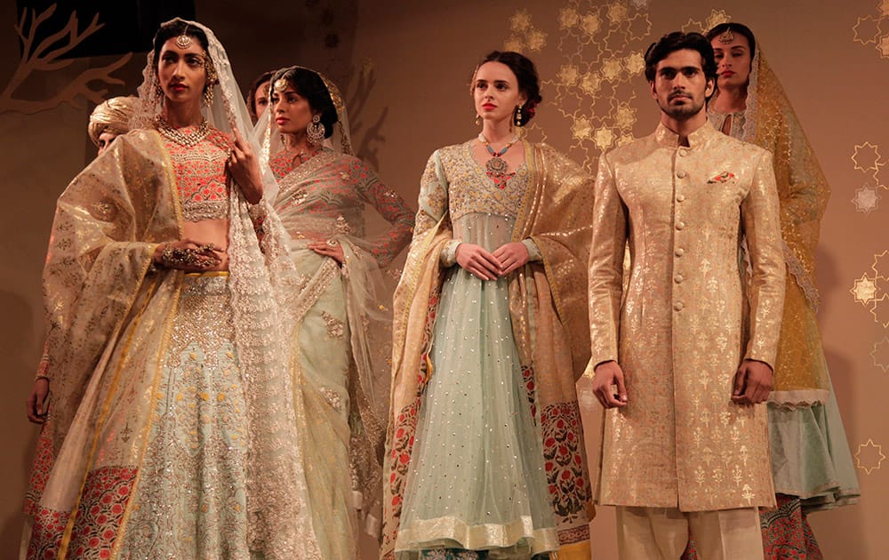 Models display creations by designer Anju Modi at the Amazon India Couture Week 2015 in New Delhi.