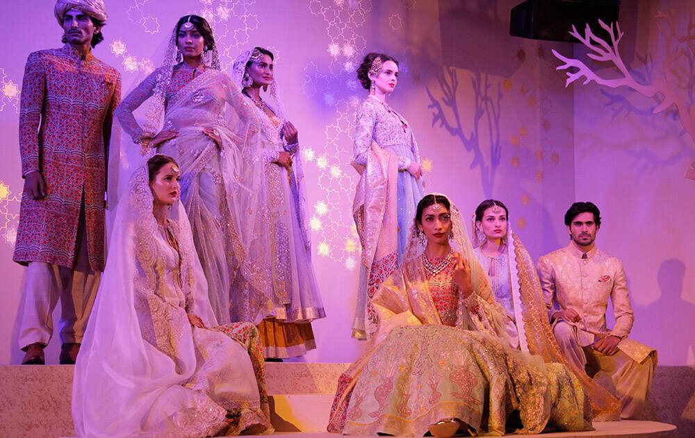 Models display creations by designer Anju Modi at the Amazon India Couture Week 2015 in New Delhi.