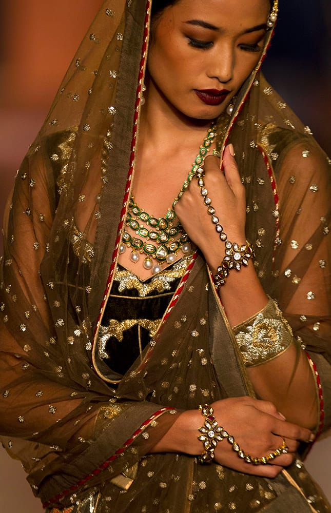 A model displays a creation by designer Reynu Taandon at the Amazon India Couture Week 2015 in New Delhi.