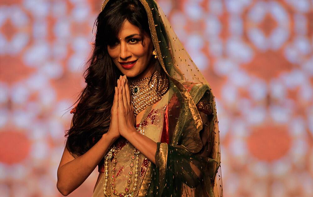 Chitrangada Singh displays a creation by designer Debarun Mukherjee at the Amazon India Couture Week 2015 in New Delhi.