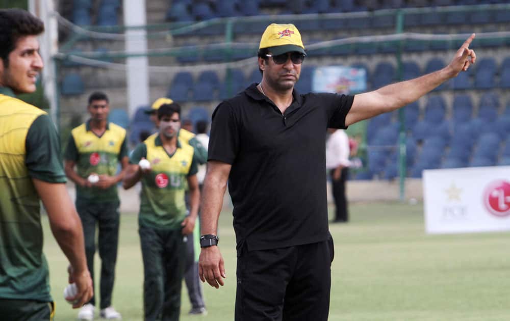 Pakistan's former cricketer Wasim Akram gestures during a fast bowlers training camp at National Stadium in Karachi.