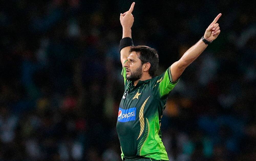 Pakistans Shahid Afridi celebrates the dismissal of Sri Lankas Dhananjaya de Silva during the second Twenty20 cricket match between them.