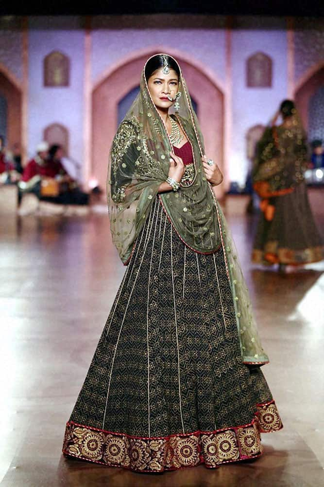 A model displays creations at the India Couture Week 2015 in New Delhi.
