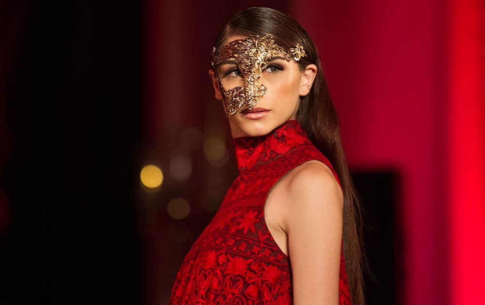 A model displays a creation by Indian designer Manish Malhotra at the Amazon India Couture Week 2015 in New Delhi.