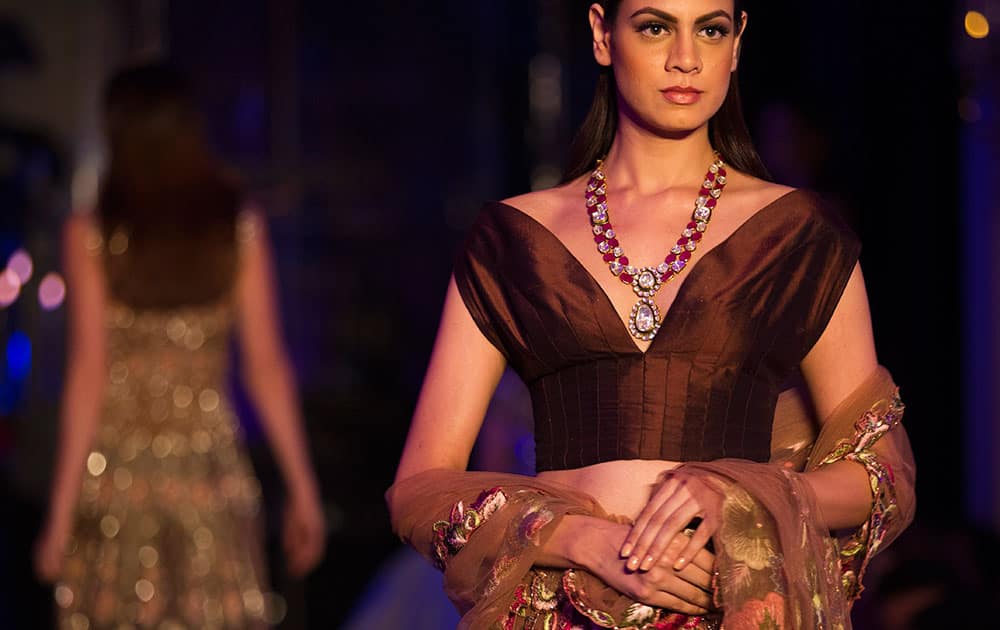 A model displays a creation by Indian designer Manish Malhotra at the Amazon India Couture Week 2015 in New Delhi.