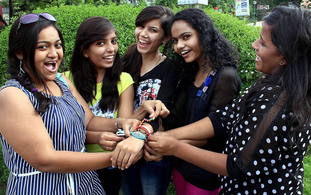 College students tie friendship bands and celebrate Friendship day in Nagpur.
