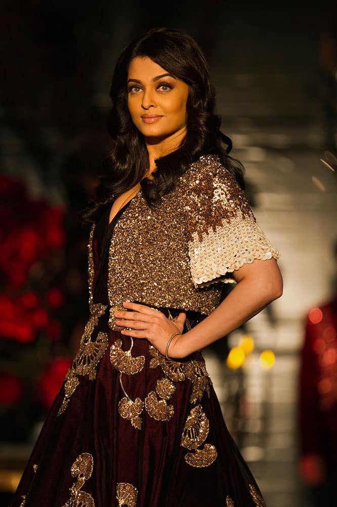 Bollywood actor Aishwarya Rai Bachchan displays a creation by Indian designer Manish Malhotra at the Amazon India Couture Week 2015 in New Delhi.