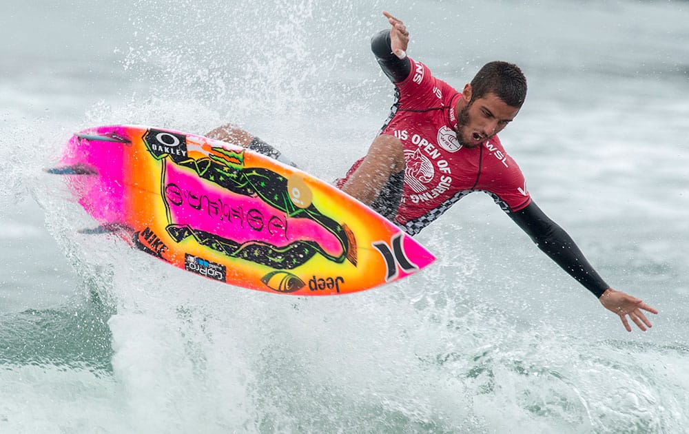 Filipe Toledo, of Brazil, surfs during his semi-final heat at the U.S. Open of Surfing in Huntington Beach, Calif. 