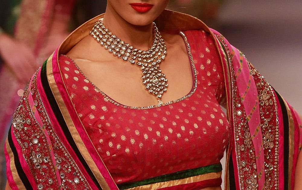 A model displays creations during a fashion show at the India International Jewelry Week in Mumbai.