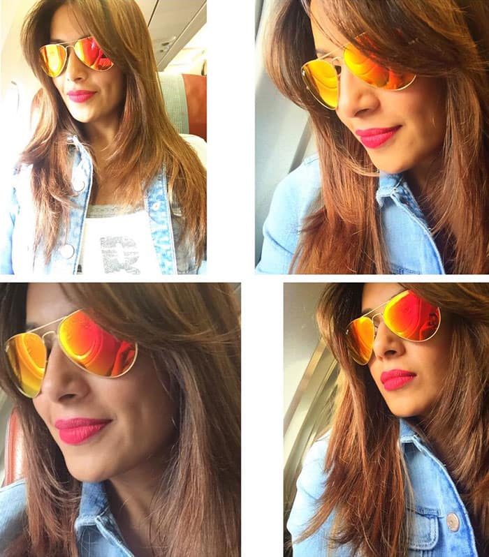 Bipasha Basu :- Brighten up your early mornings with bright aviators❤ Travel look! -twitter