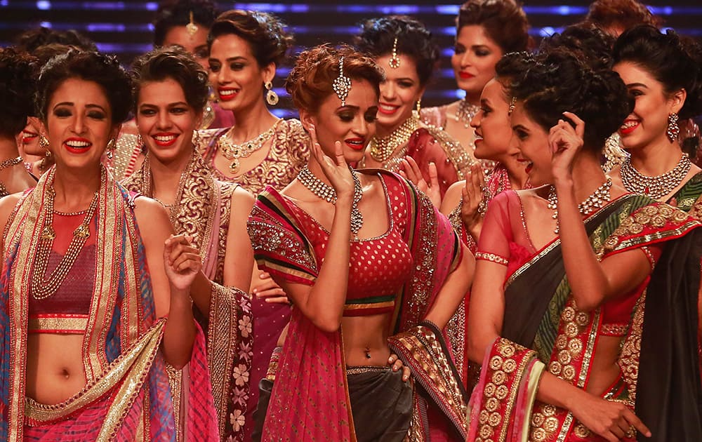 Models display creations during a fashion show at the India International Jewellery Week in Mumbai.