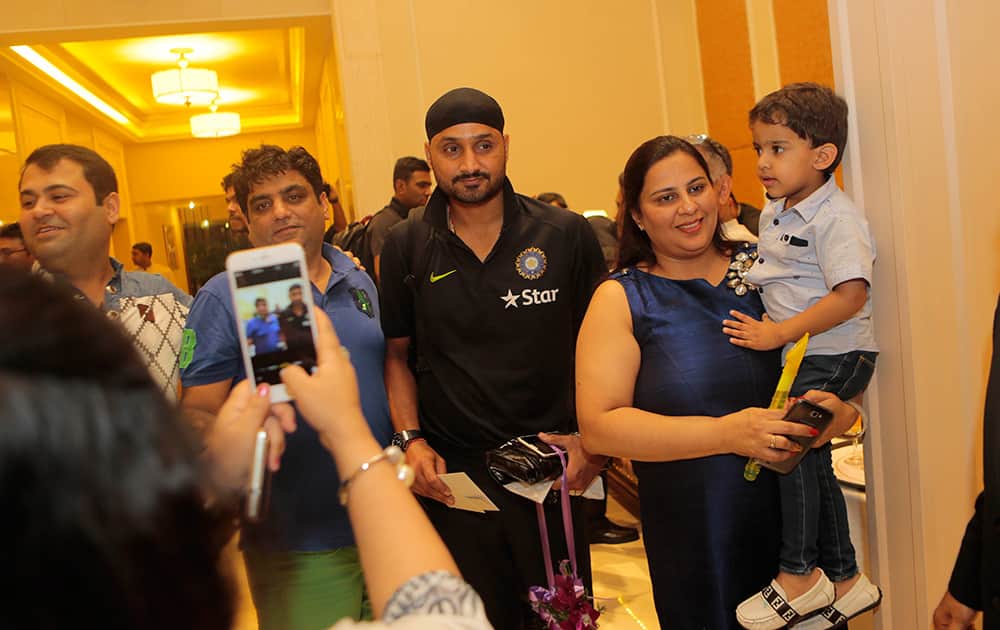 Harbhajan Singh poses for photographs with fans after arriving at their team hotel in Colombo, Sri Lanka. Indian cricket team is in Sri Lanka to play a three test match series that begins Aug. 12. 