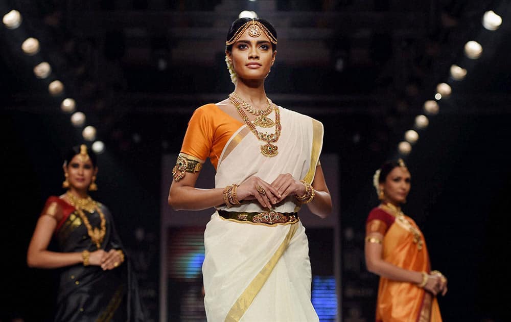 Models walk the ramp during India International Jewellery Week in Mumbai.