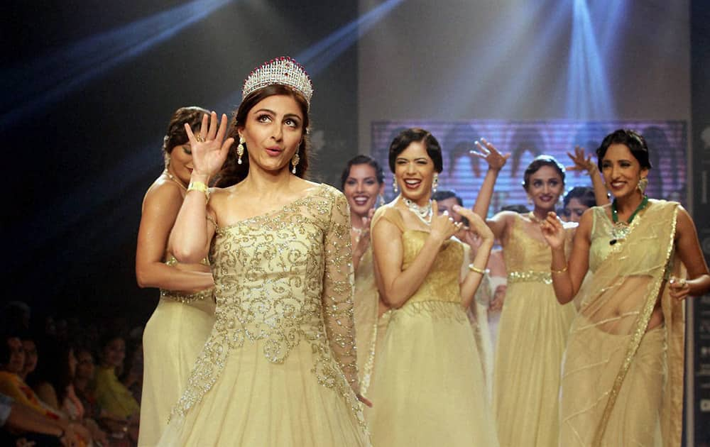 Actress Soha Ali Khan walks the ramp with models at India International Jewellery Week in Mumbai.