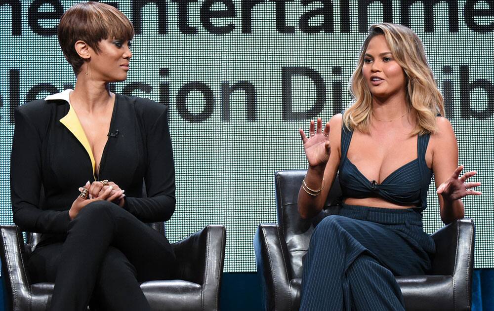 Tyra Banks, left, and Chrissy Teigen participate in the 