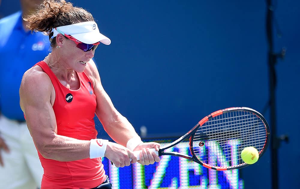 Samantha Stosur, of Australia, returns the ball against Kristina Mladenovic, of France, at the Citi Open tennis tournament in Washington. 