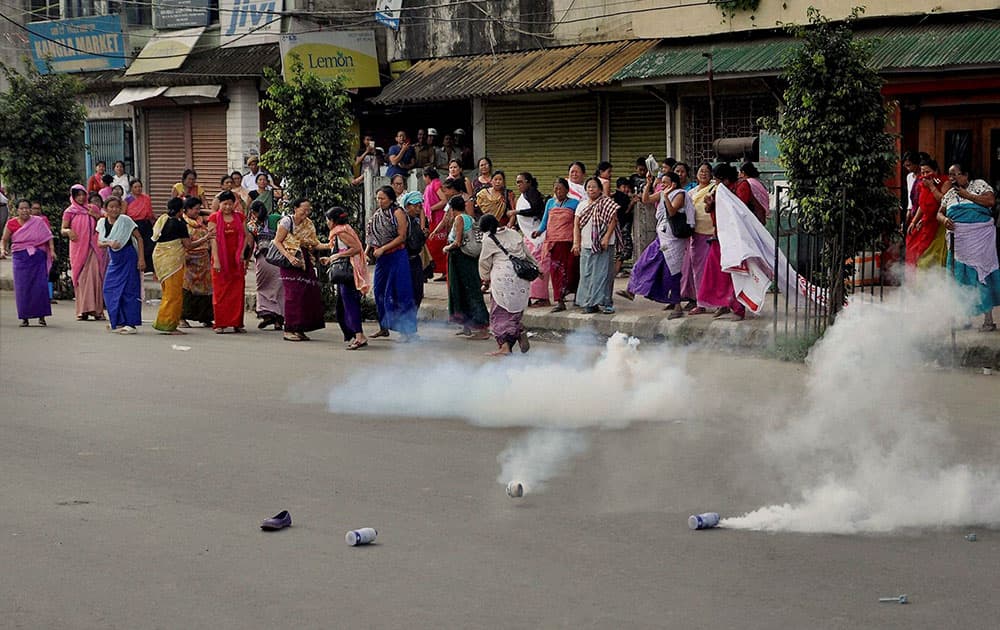 Police fire tearsmoke shells to disperse women vendors of Khwairamban Ima Market protest in Imphal on Tuesday demanding Inner Line Permit System in Manipur. 