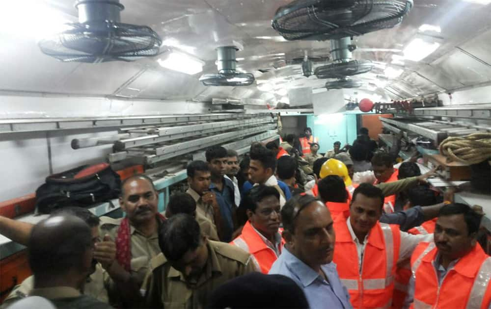 Twin Train Derailment in MP: NDRF and rescue officials inside a bogey which derailed. Twitter@ANI_news