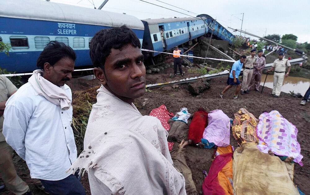 People try to identify relatives near the wreckage of Kamayani Express and Janata Express trains which derailed within minutes of each other while crossing a small bridge at Harda in Madhya Pradesh.