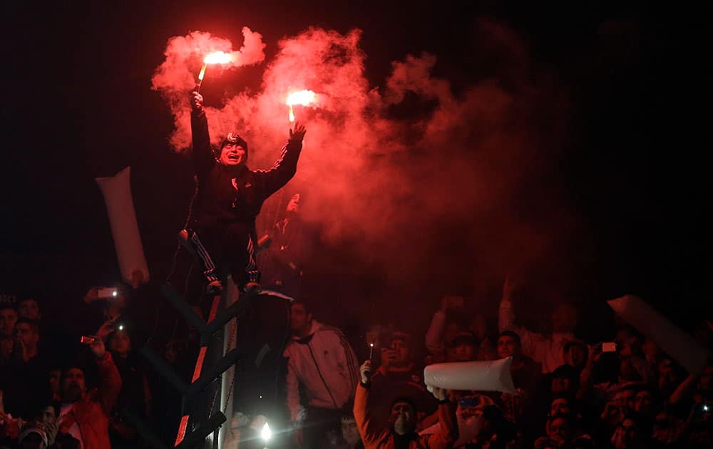 Argentina's River Plate fans cheer for their team before the Copa Libertadores final soccer match against Mexico's Tigres, in Buenos Aires, Argentina.