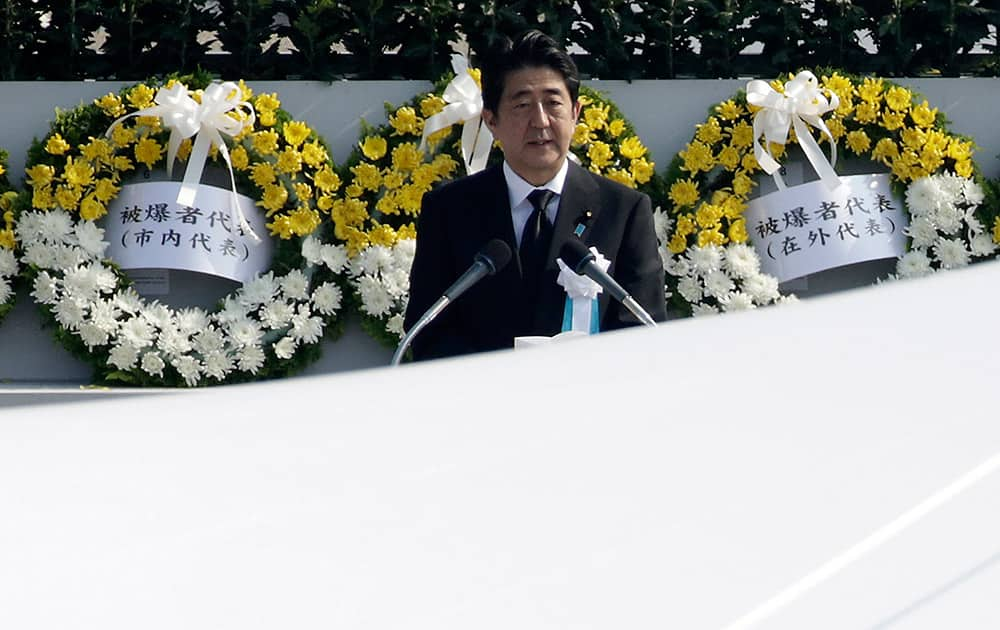 Japanese Prime Minister Shinzo Abe delivers a speech during the ceremony to mark the 70th anniversary of the bombing at the Hiroshima Peace Memorial Park in Hiroshima, western Japan.