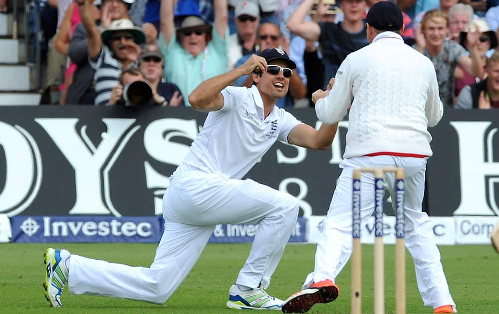 England’s Alastair Cook, left, celebrates after catching Australia’s Chris Rogers bowled Stuart Broad for a duck during day one of the fourth Ashes Test cricket match, at Trent Bridge, Nottingham, England.