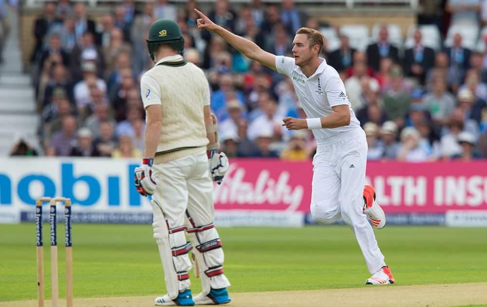 England's Stuart Broad celebrates his 300th test wicket, that of Australia's Chris Rogers, left, caught by Alastair Cook for 0, on the first day of the fourth Ashes test cricket match between England and Australia at Trent Bridge cricket ground in Nottingham.