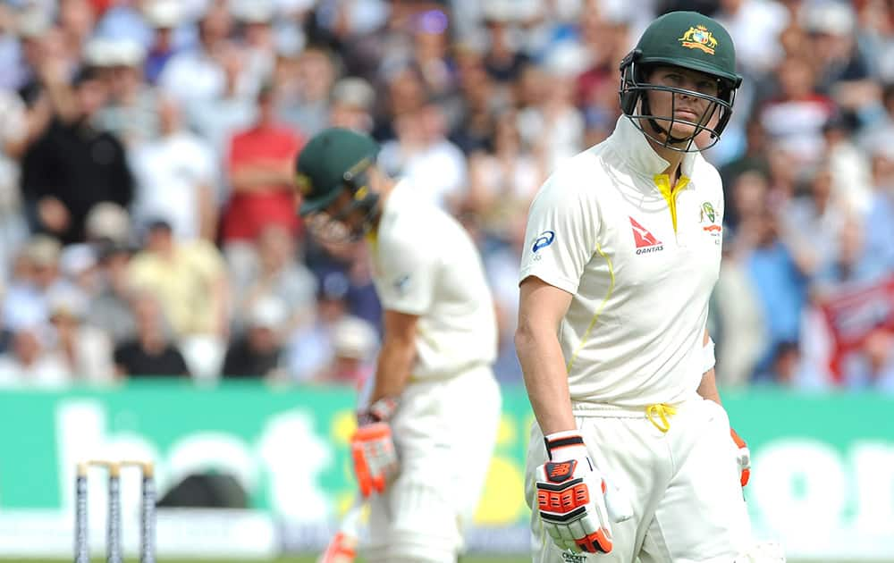 Australia’s Steven Smith walks back to the pavilion after being bowled by Stuart Broad caught England’s Joe Root for 6 runs during day one of the fourth Ashes Test cricket match, at Trent Bridge, Nottingham.