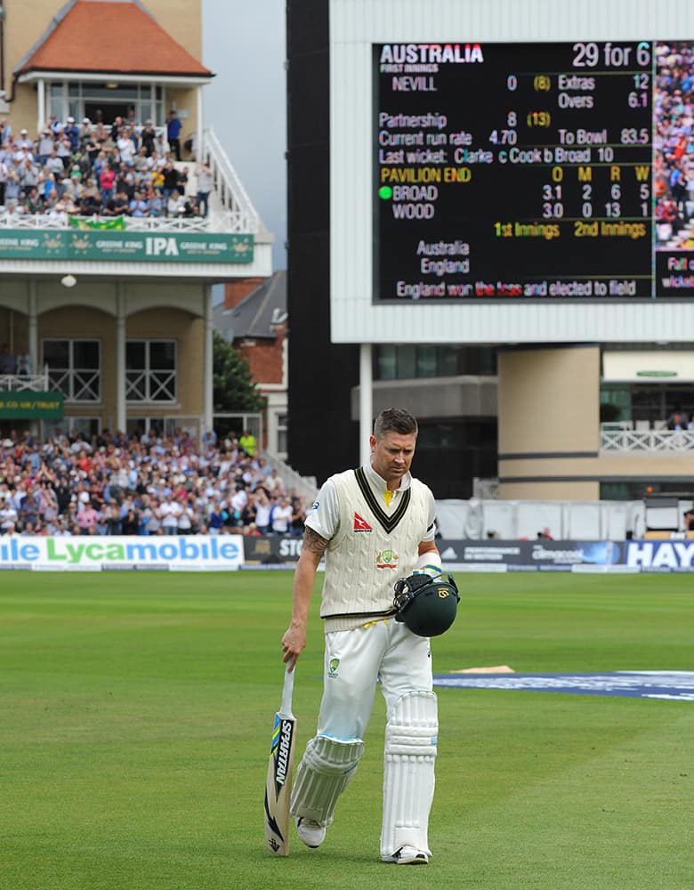 The scoreboard shows 29 for 6 as Australia’s Michael Clarke returns to the pavilion after being bowled by England’s Stuart Broad caught Alastair Cook for 10 runs during day one of the fourth Ashes Test cricket match, at Trent Bridge, Nottingham, England.