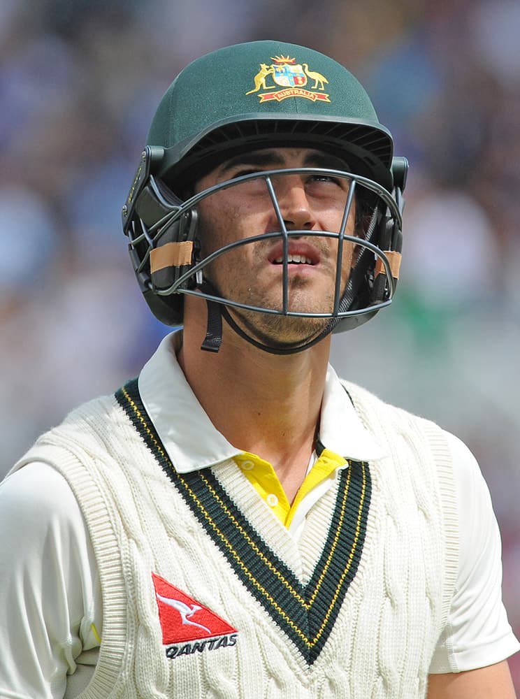 Australia’s Mitchell Starc returns to the pavilion after being bowled by England’s Stuart Broad caught Joe Root for 1 run during day one of the fourth Ashes Test cricket match, at Trent Bridge, Nottingham, England.