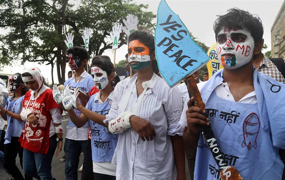 College students participate in a rally to mark the 70th anniversary of atomic bombing at Hiroshima, in Mumbai.