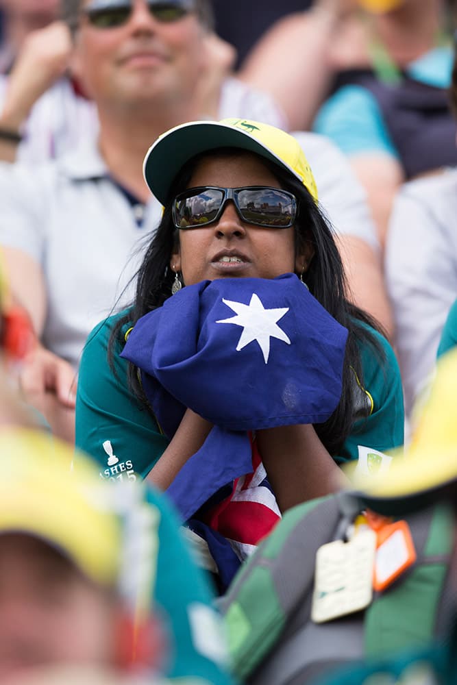 An Australian fan sits in the stands as the team struggle during the first session on the first day of the fourth Ashes test cricket match between England and Australia at Trent Bridge cricket ground in Nottingham, England.