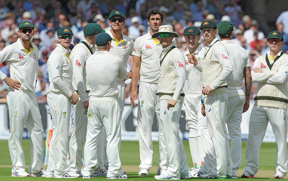 Australia team look at a replay on a TV screen after Australia’s Mitchell Starc bowled England’s Adam Lyth caught Peter Nevill for 14 runs during day one of the fourth Ashes Test cricket match, at Trent Bridge, Nottingham, England.