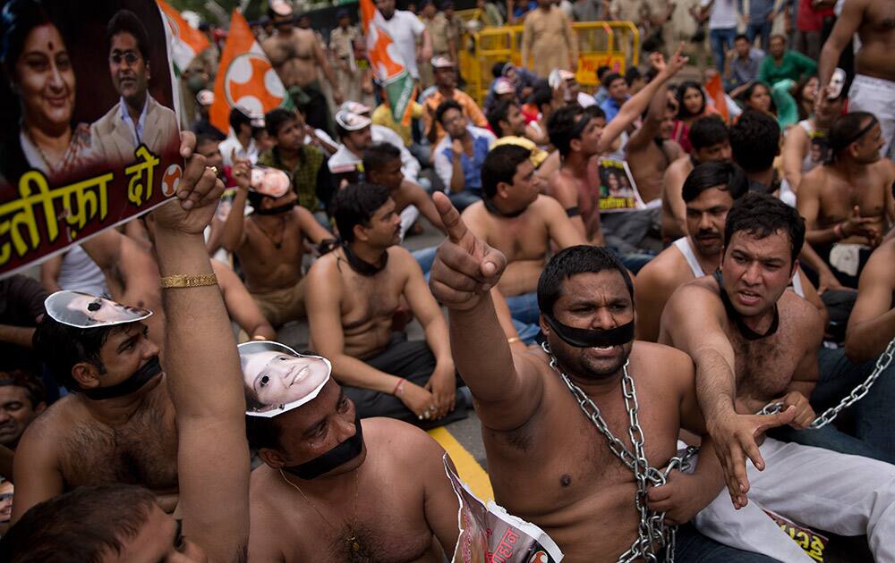 Bare chest protesters of India's opposition Congress party's youth wing shout slogans during a protest in New Delhi. The protesters demonstrated against the decision of Lok Sabha, or the lower house speaker, Sumitra Mahajan of the ruling Bharatiya Janata Party (BJP), who suspended 25 Congress party members from the Lok Sabha. 