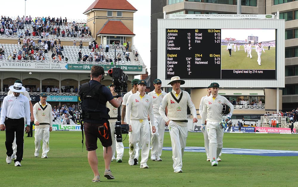 Australia players leave the pitch at end of the day's play 214 runs behind, during day one of the fourth Ashes Test cricket match, at Trent Bridge, Nottingham, England.