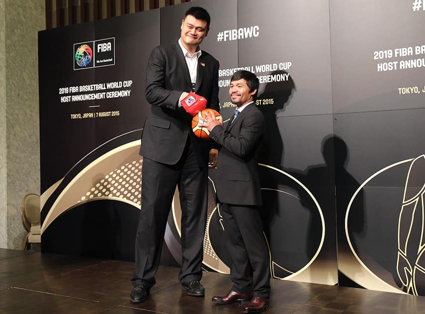 China 2019 Ambassador and former basketball star Yao Ming, left, and Philippine Congressman and eight-time world boxing champion Manny Pacquiao pose for a photo ahead of FIBA's announcement on whether the Philippines or China will host the 2019 Basketball World Cup, in Tokyo.
