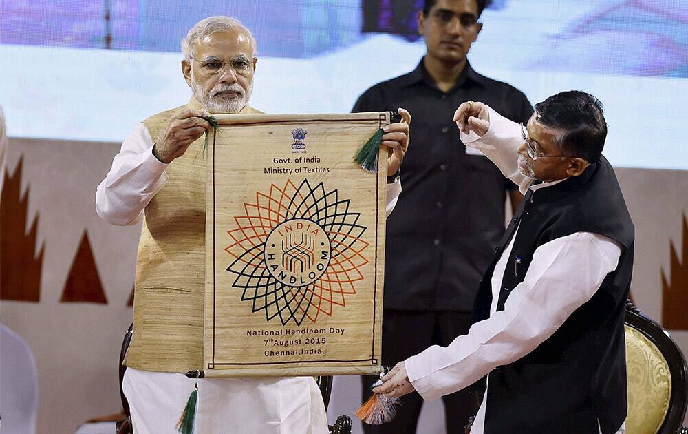 Prime Minister Narendra Modi with Union Minister of State for Textiles (Independent Charge ) Santosh Kumar Gangwar at the inauguration of the National Handloom Day in Chennai.