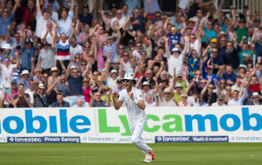 England's Stuart Broad celebrates after catching Australia's David Warner, out for 64 off the bowling of Ben Stokes on the second day of the fourth Ashes test cricket match between England and Australia at Trent Bridge cricket ground in Nottingham, England.