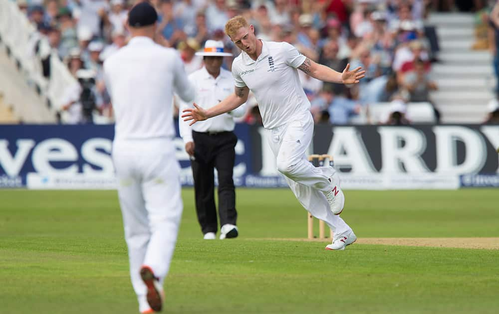 England's Ben Stokes celebrates taking the wicket of Australia's Shaun Marsh, caught by Joe Root for two, on the second day of the fourth Ashes test cricket match between England and Australia at Trent Bridge cricket ground in Nottingham, England.