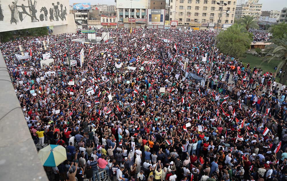 Protesters chant anti-Iraqi government slogans in Tahrir Square in Baghdad, Iraq.
