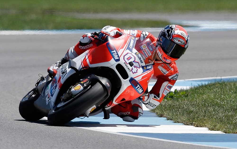 Andrea Dovizioso, of Italy, rides through a turn during the second practice for the Indianapolis Grand Prix motorcycle race at Indianapolis Motor Speedway in Indianapolis.