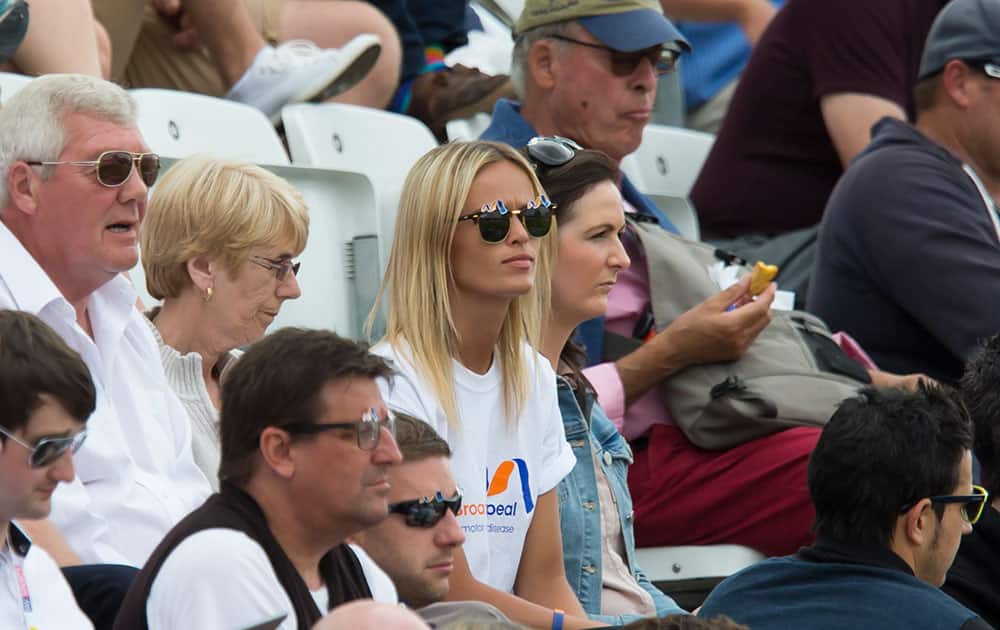 Bealey Mitchell, centre, girlfriend of England cricketer Stuart Broad sits in the stands on the second day of the fourth Ashes test cricket match between England and Australia at Trent Bridge cricket ground in Nottingham.