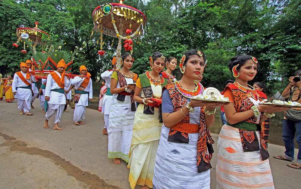 Saplings are being carried in a decorated palanquin for plantation by students of Visva Bharati University on the occasion of 74th death anniversary of Rabindranath Tagore at Santiniketan in Birbhum district of West Bengal.