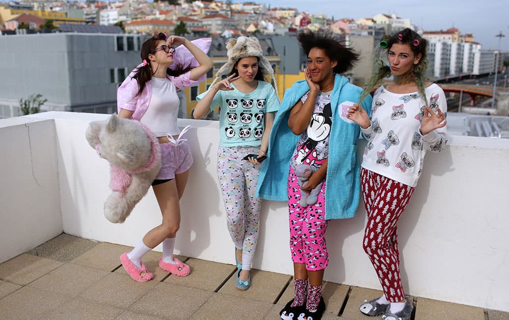 Members of the group Sa.weet pose for a picture on the roof of Lisbon's Orient Museum while waiting for their turn to perform at the Portuguese K-Pop festival.