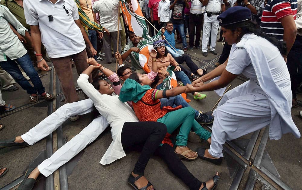 Police detain Chhatra Parishad activists during their agitation and road blockade programme in Kolkata on Saturday to protest against the alleged lynching of a student in college in West Midnapore district. 