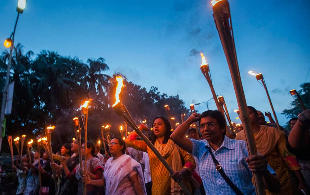 Bangladeshi secular activists participate in a torch rally held to protest against the killing of blogger Niloy Chottopadhay, 40, in Dhaka, Bangladesh.