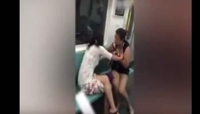 Watch: Two women fight for seat in subway train, tear-off each other&#039;s clothes