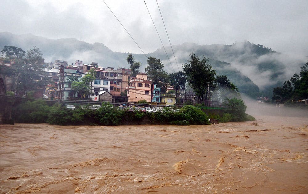 River Beas in full spate in Mandi as it continues to rain in Himachal Pradesh. The state administration has issued high alert precautions all over the state in view of the downpour, in Mandi.