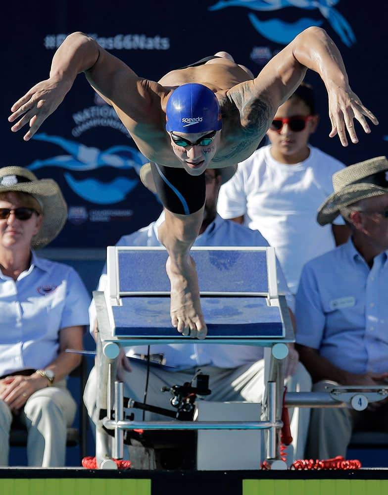 Caeleb Dressel competes in the finals of the men's 100-meter freestyle at the the U.S. swimming nationals in San Antonio. 